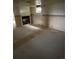 View of a basement area with water damaged walls and a fireplace at 554 E Pleasant Ave, Byers, CO 80103