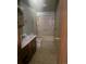A bathroom with an extended shower head, toilet and vanity at 554 E Pleasant Ave, Byers, CO 80103