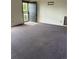 Bedroom with wall-to-wall carpet and an open doorway at 554 E Pleasant Ave, Byers, CO 80103
