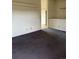 Bedroom with wall-to-wall carpet at 554 E Pleasant Ave, Byers, CO 80103