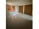 Bedroom with tiled floors and two windows at 554 E Pleasant Ave, Byers, CO 80103