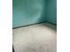 View of a bedroom with light blue walls and light-colored carpet at 554 E Pleasant Ave, Byers, CO 80103