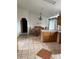 Dining area with wood table and chairs, tile flooring, and chandelier at 554 E Pleasant Ave, Byers, CO 80103