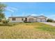 Charming single-story home with a two car garage, inviting porch, and ample front yard space at 554 E Pleasant Ave, Byers, CO 80103