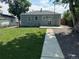Spacious backyard with a well-maintained lawn, privacy fence, and ample space for outdoor activities and relaxation at 1125 Nome St, Aurora, CO 80010