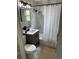 Stylish bathroom with marble tile, modern fixtures, and a vanity offering storage space at 1125 Nome St, Aurora, CO 80010