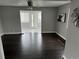Bright living room featuring dark hardwood floors, neutral paint, and open space for entertaining at 1125 Nome St, Aurora, CO 80010