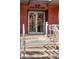 Modern building entrance with double doors and brick facade at 1440 Little Raven St # 204, Denver, CO 80202