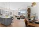 Open concept dining area with wooden table and chairs at 1440 Little Raven St # 204, Denver, CO 80202