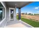 Open back porch with scenic views of an empty lot and surrounding neighborhood at 1369 Burt Ave, Berthoud, CO 80513