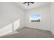 Bright bedroom features neutral carpeting and a window view at 1369 Burt Ave, Berthoud, CO 80513