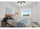 Bright bedroom with a full-size bed and light blue bedding at 1369 Burt Ave, Berthoud, CO 80513