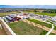 Aerial view of community center with pool and park at 1369 Burt Ave, Berthoud, CO 80513