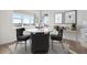 Kitchen dining area with a round table and four dark gray chairs at 1369 Burt Ave, Berthoud, CO 80513