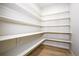 Bright walk-in pantry with white shelves at 1369 Burt Ave, Berthoud, CO 80513