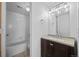 Well-lit bathroom with a modern vanity, updated fixtures, and a shower-tub combination at 7665 E Eastman Ave # D304, Denver, CO 80231