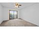 Spacious bedroom with sliding glass door and ceiling fan at 7665 E Eastman Ave # D304, Denver, CO 80231