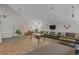 Common room area featuring seating, a table, and a large tv at 7665 E Eastman Ave # D304, Denver, CO 80231