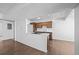 Bright kitchen features light countertops, wood cabinets, and wood floors at 7665 E Eastman Ave # D304, Denver, CO 80231