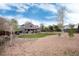Property featuring an exterior with a covered patio, gravel yard, and landscaping at 13093 Hudson St, Thornton, CO 80241