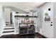 Stylish bar area with open access to the kitchen and featuring a metal bar cart with wine and liquor storage at 13093 Hudson St, Thornton, CO 80241