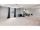 Well-lit basement space with a window, exercise equipment, and a mirror, offering flexibility at 13093 Hudson St, Thornton, CO 80241