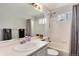 Bathroom with a shower and tub, and a large mirror above the sink at 13093 Hudson St, Thornton, CO 80241