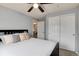 Bedroom with a ceiling fan, closet, and a door leading to the hallway at 13093 Hudson St, Thornton, CO 80241