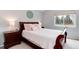 Cozy bedroom with a queen-sized bed, two nightstands, and a window overlooking the outdoors at 13093 Hudson St, Thornton, CO 80241