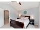 Comfortable bedroom featuring a queen-sized bed, a nightstand, and a ceiling fan at 13093 Hudson St, Thornton, CO 80241