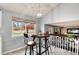 Cozy kitchen nook features a round wooden table, three chairs, and a view of the backyard at 13093 Hudson St, Thornton, CO 80241