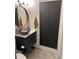Modern bathroom with vessel sink, granite countertop, and floating vanity at 4878 E Kentucky Ave # A, Denver, CO 80246