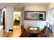 View of the dining area and a glimpse of the bathroom from the kitchen at 4878 E Kentucky Ave # A, Denver, CO 80246