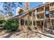 Exterior view of building with multiple units, stone landscaping, and walkways at 4878 E Kentucky Ave # A, Denver, CO 80246