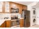 Updated kitchen featuring stainless steel appliances, quartz countertops, and shaker cabinets at 4878 E Kentucky Ave # A, Denver, CO 80246