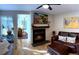 Comfortable living room with a fireplace, hardwood floors, and an opening to the bedroom at 4878 E Kentucky Ave # A, Denver, CO 80246