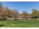 Grassy area with fence in front of apartment buildings at 4878 E Kentucky Ave # A, Denver, CO 80246