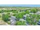 Aerial shot of a blue apartment complex with garages, mature trees, and neighborhood surroundings at 8065 W Eastman Pl # 6-102, Denver, CO 80227