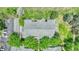 Birds eye view of building roof surrounded by lush landscape and parking area at 8065 W Eastman Pl # 6-102, Denver, CO 80227
