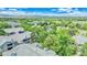 Picturesque aerial view of rooftops amidst lush trees, showcasing the charm of the community at 8065 W Eastman Pl # 6-102, Denver, CO 80227