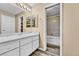Bathroom featuring modern vanity, walk-in closet, and tub shower at 8065 W Eastman Pl # 6-102, Denver, CO 80227