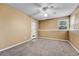 Clean, empty bedroom with neutral walls, carpet, and a ceiling fan at 8065 W Eastman Pl # 6-102, Denver, CO 80227