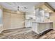 Open kitchen with pendant lighting, white cabinetry and stainless appliances at 8065 W Eastman Pl # 6-102, Denver, CO 80227