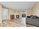 Living room with a fireplace and sliding glass doors leading to the balcony at 8065 W Eastman Pl # 6-102, Denver, CO 80227