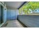 Covered patio area with a small storage closet and a view of the outdoor greenery at 8065 W Eastman Pl # 6-102, Denver, CO 80227