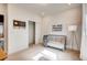 Bright bedroom featuring a crib, a closet, and natural light streaming through the window at 13806 Honey Hush Trl, Parker, CO 80134