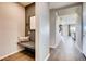 Inviting entryway with a built-in bench and mirror, leading to a bright living area at 13806 Honey Hush Trl, Parker, CO 80134