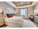 Spacious bedroom with a cozy rug, stylish furnishings, a wood plank ceiling, and plenty of natural light at 13806 Honey Hush Trl, Parker, CO 80134