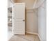 Walk-in closet with built-in shelving and carpeted flooring provides organized storage at 13806 Honey Hush Trl, Parker, CO 80134