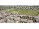 Community aerial view showcasing well-maintained homes, green spaces, and a baseball field, highlighting neighborhood amenities at 15565 E 115Th Ave, Commerce City, CO 80022